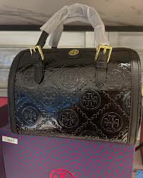 【送料0/国内即発】トリー バーチTモノグラムミニエンボスメタルシャイニーバケットバッグ